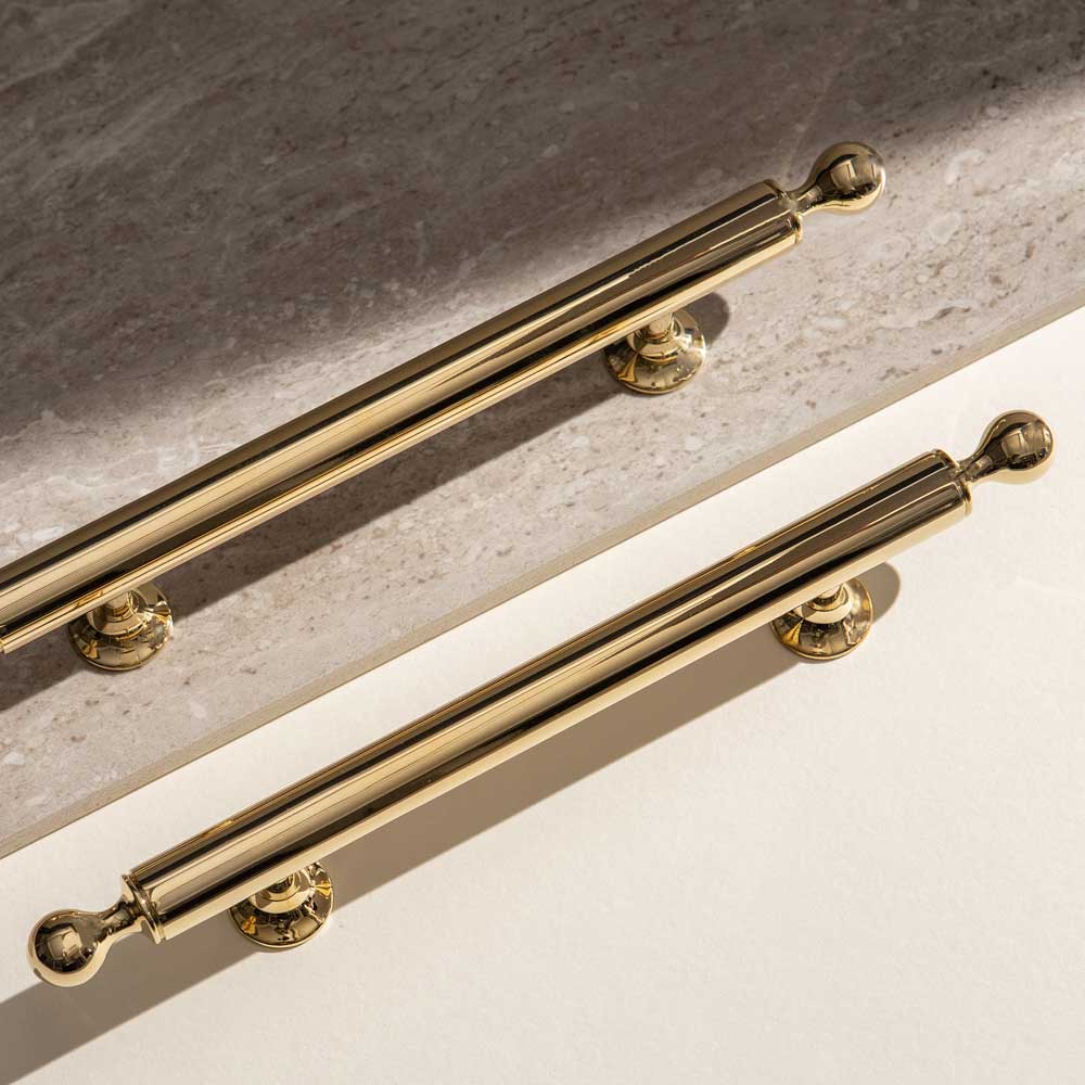 Armac Martin luxury architectural hardware photo of brass pull handles on stone ware surface
